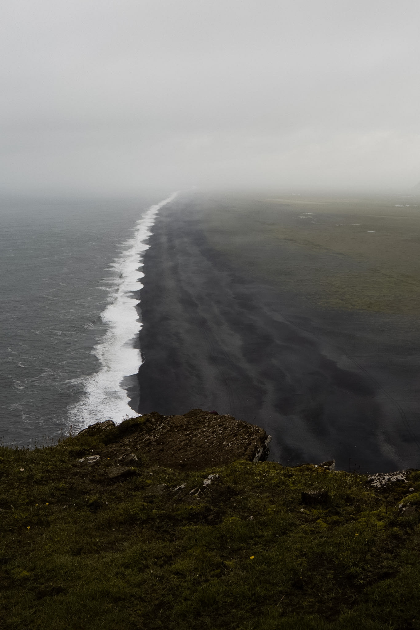 High angle view of black sand beach and ocean waves